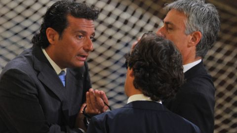 Costa Concordia captain Francesco Schettino speaks with officials before his trial Wednesday in Grosseto.