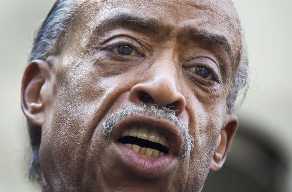 The Rev. Al Sharpton calls for a full federal investigation of the Martin killing, saying mere remarks by President Barack Obama and others weren't enough, outside the U.S. Justice Department in Washington on July 16.