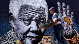 South African artist John Adams works on a giant painting of Nelson Mandela in a suburb of Johannesburg. Mandela, an anti-apartheid icon and Nobel peace laureate, endured 27 years in prison before becoming South Africa's first democratically elected president. Click through the gallery for other artistic tributes to "the world's most famous political prisoner."