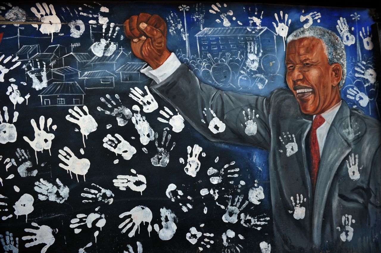 <strong>SOUTH AFRICA: </strong>A mural of Mandela is displayed near his former house in the Alexandra Township in Johannesburg.