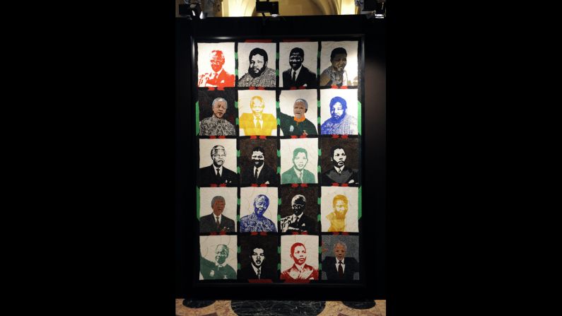 <strong>FRANCE: </strong>Artwork featuring Mandela over the years is on display at an exhibition in Paris.