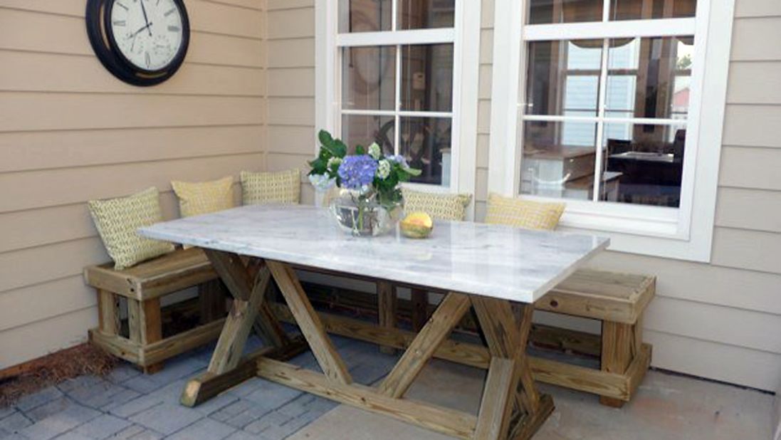 <a href="http://ireport.cnn.com/docs/DOC-1003865">Rina Norwood</a> enjoys dining al fresco in the corner of her patio where she built a banquette and used salvage marble as a table top.
