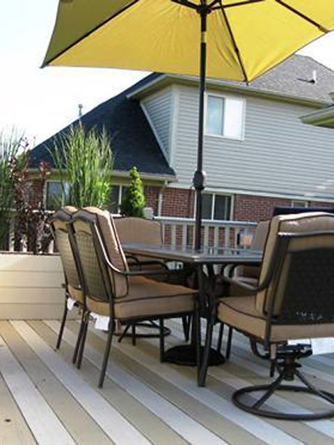 <a href="http://ireport.cnn.com/docs/DOC-1005429">Corrie Moore</a> and her husband painted their deck boards in tan and cream stripes to give the illusion of a larger deck.