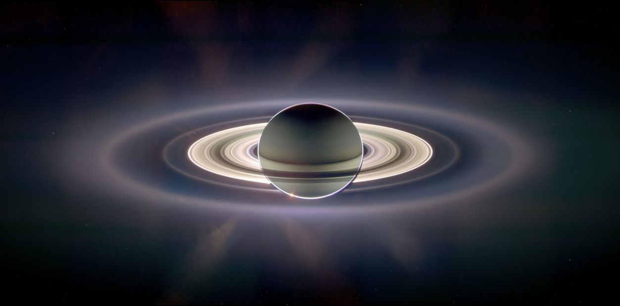NASA's Cassini spacecraft has taken pictures of Saturn and Earth before. In this 2006 image, Earth is a tiny dot on the left, just to the inside of the second outer ring.
