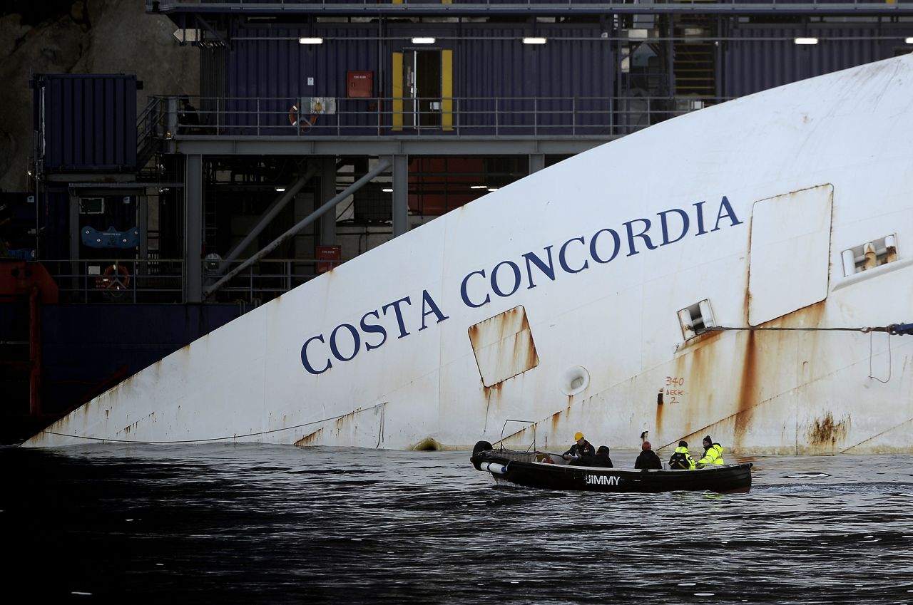 A crew passes by the hulking remains on January 7, 2013.