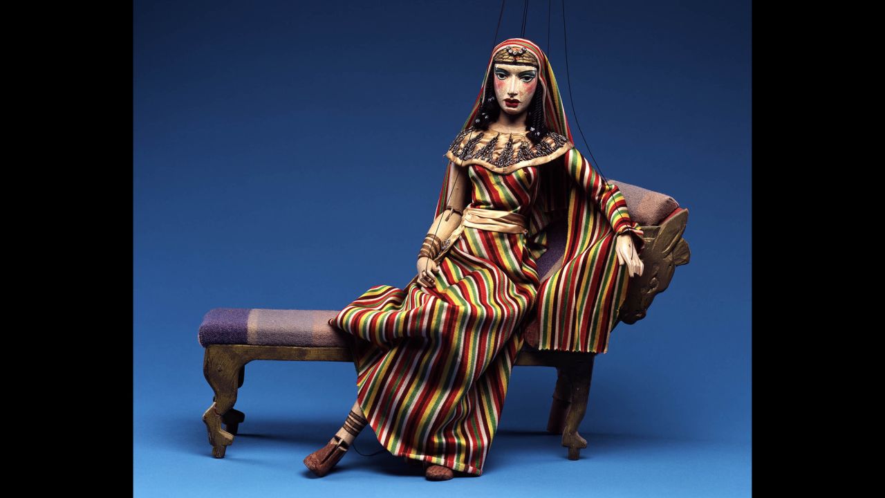 The museum's collection also includes set pieces, like the chaise that this puppet version of Cleopatra is reclining on. 