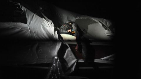 Tsarnaev exits the boat during his capture.  The pictures were taken by Murphy and published online by Boston Magazine.