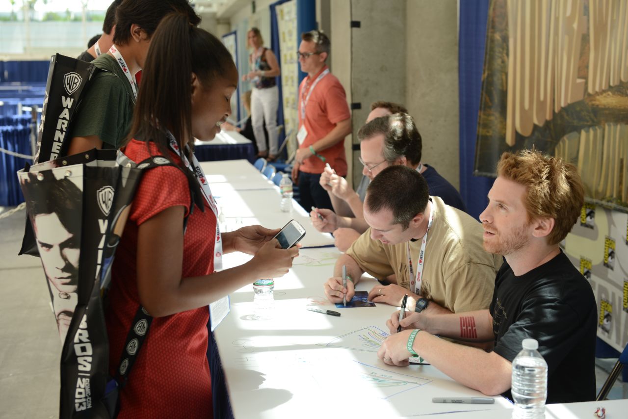 Actor, comedian and screenwriter Seth Green speaks with a fan at the "Robot Chicken" signing on July 18.