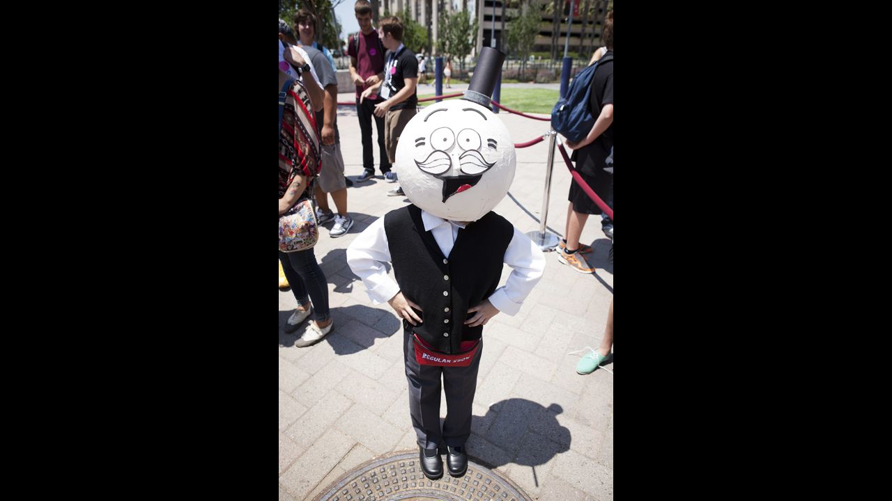 A fan dressed as Pops from Cartoon Network's "Regular Show" poses for a photo on July 18.