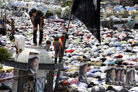 Supporters of Morsy pause for Friday prayers on July 19 at Nasr City in Cairo, where protesters have installed their camp and held daily rallies.