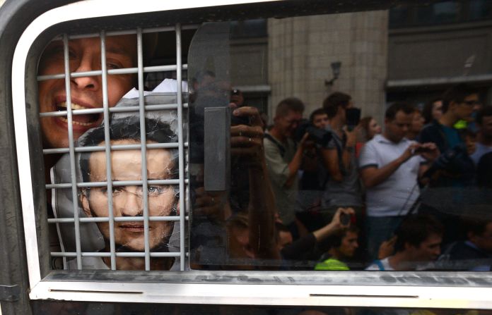 JULY 19 - MOSCOW, RUSSIA: A supporter of convicted opposition leader Alexei Navalny is detained by police during a demonstration in Moscow. Navalny, one of president Vladimir Putin's most outspoken critics, was found <a href="http://cnn.com/2013/07/19/world/europe/russia-navalny-case/index.html?hpt=hp_t1">guilty of misappropriating funds</a>. The EU called the trial a sham.