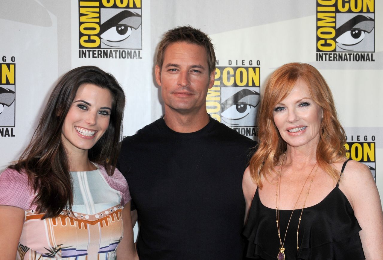 Actors Meghan Ory, left, Josh Holloway and Marg Helgenberger speak onstage at the "Intelligence" panel at San Diego Convention Center<strong> </strong>on July 18. The sci-fi TV series is set to premiere in February.