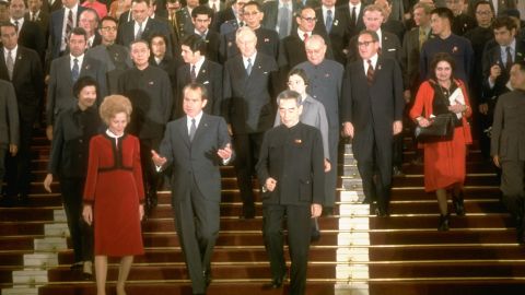 Thomas, right, walks behind President Richard Nixon and a large group in China on February 1, 1972.
