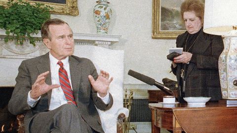 Thomas takes notes as President George H.W. Bush speaks with reporters in Washington on January 21, 1989.