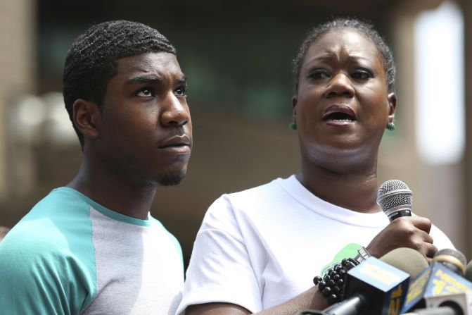 Sybrina Fulton, mother of Trayvon Martin, is joined by her son Jahvaris Fulton as she speaks to the crowd during a rally in New York City, Saturday, July 20. A jury in Florida acquitted Zimmerman of all charges related to the shooting death of Trayvon Martin. <a href="index.php?page=&url=http%3A%2F%2Fwww.cnn.com%2F2013%2F06%2F27%2Fjustice%2Fgallery%2Fzimmerman-trial%2Findex.html">View photos of key moments from the trial.</a>