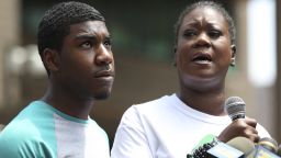 Sybrina Fulton, mother of Trayvon Martin, is joined by her son Jahvaris Fulton as she speaks to the crowd during a rally in New York City, Saturday, July 20. A jury in Florida acquitted Zimmerman of all charges related to the shooting death of Trayvon Martin. View photos of key moments from the trial.
