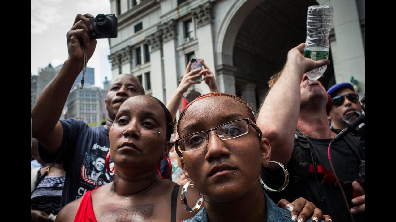 Protesters attend a rally in support of Trayvon Martin, in New York  on July 20. The Rev. Al Sharpton's National Action Network organized the "'Justice for Trayvon' 100 city vigil" which called supporters to gather in front of federal buildings around the country on July 20, as a continued protest against the George Zimmerman verdict.