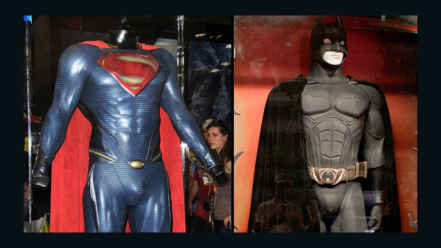 The Superman costume from "Man of Steel" and the Batman costume from "Batman Begins" are displayed in cases