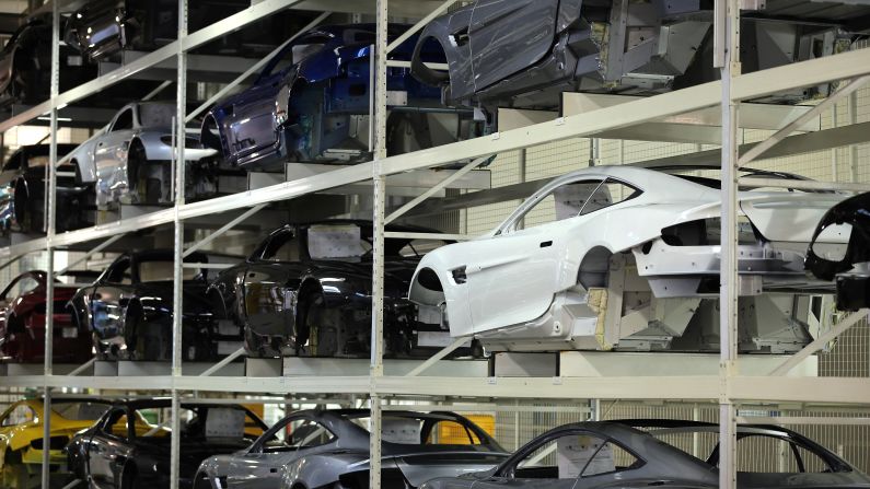 The company's ownership has changed several times over the past century, including 13 years with Ford Motor Company from 1994 to 2007. Above, Aston Martin body shells wait for the assembly line at in Gaydon, England.