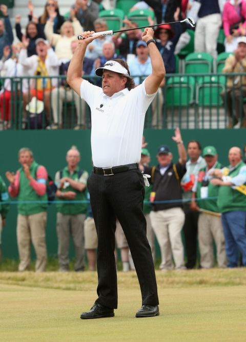 It's a dramatic final day at Muirfield. Another birdie on the 18th puts Phil Mickelson in the driving seat to win his first British Open title.