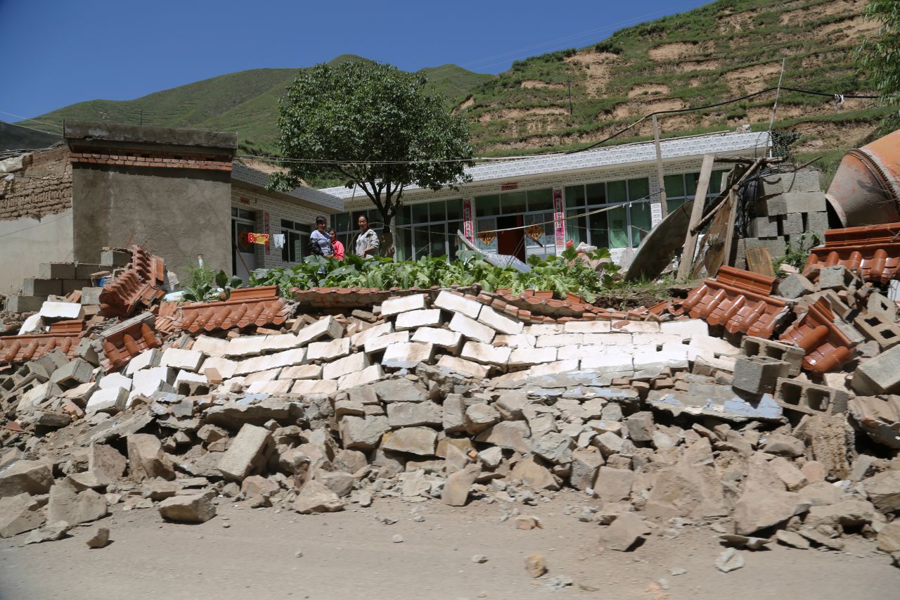 The quake leaves a wall collapsed in Hetuo township in Dingxi on July 22. Chinese President Xi Jinping has urged crews to make the rescue of survivors a priority, according to state broadcaster CCTV. 