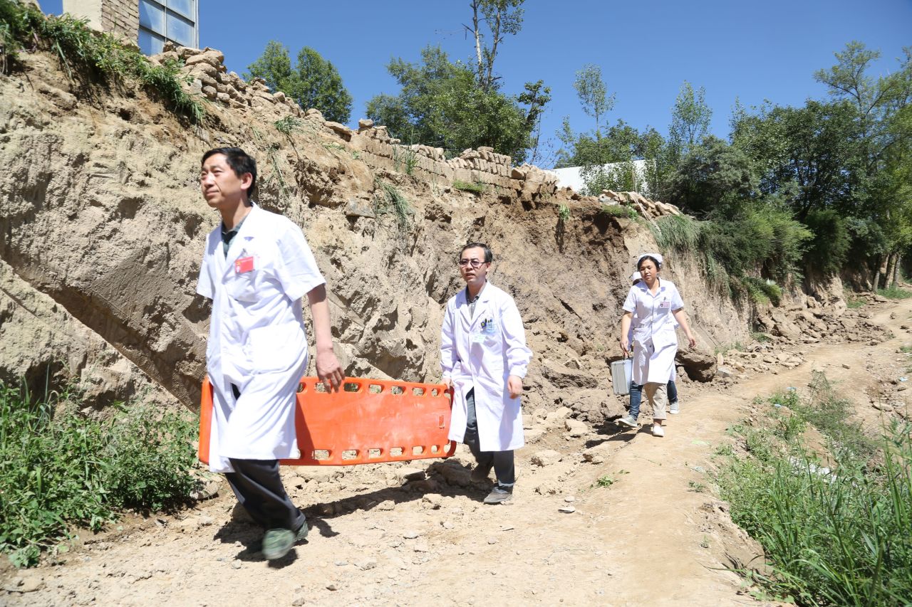 Rescuers arrive at Lalu village in Minxian on July 22.