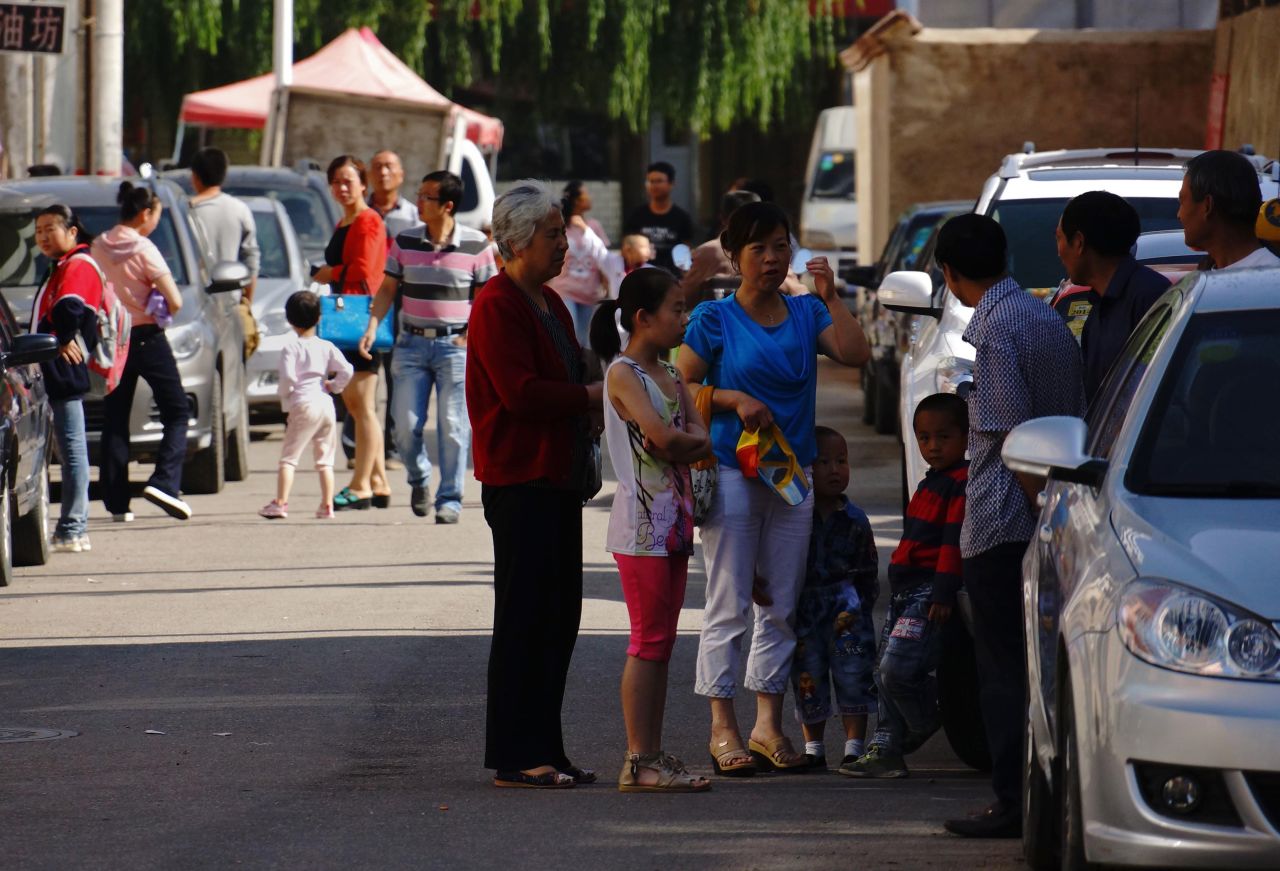 Residents try to take shelter after an earthquake in downtown Dingxi on July 22.