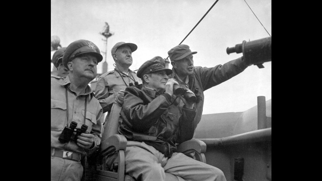 Gen. Douglas MacArthur, center, and other U.S. military personnel observe the shelling of Inchon from the U.S.S. Mt. McKinley, on September 15, 1950.