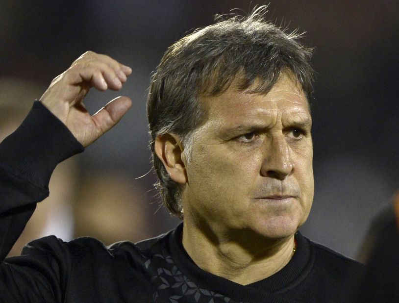 Gerardo Martino has signed a two-year deal at Barcelona after agreeing to replace former coach Tito Vilanova. 
