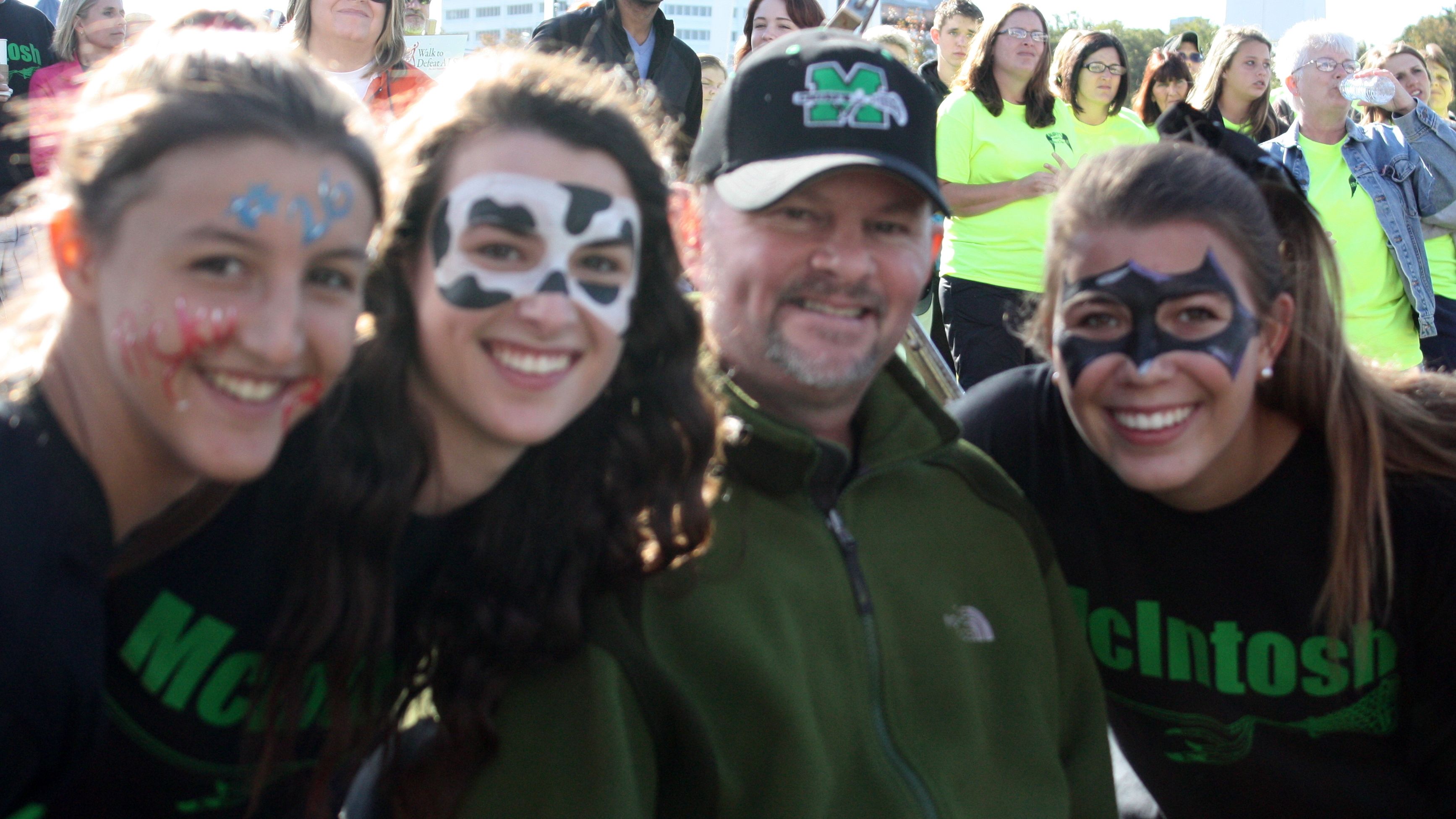 The girls often paint their faces for fundraising events, to  show their spirit and to keep Coach Mickey smiling.