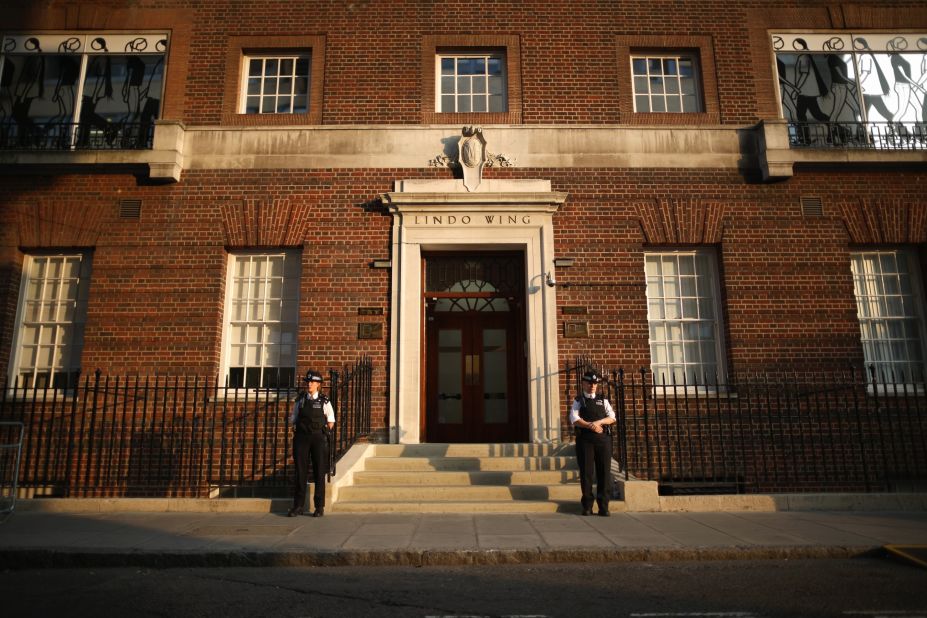 Police guard the Lindo Wing at St. Mary's Hospital in London as crowds gather and await news of the birth of the first child of the Duke and Duchess of Cambridge on July 22.