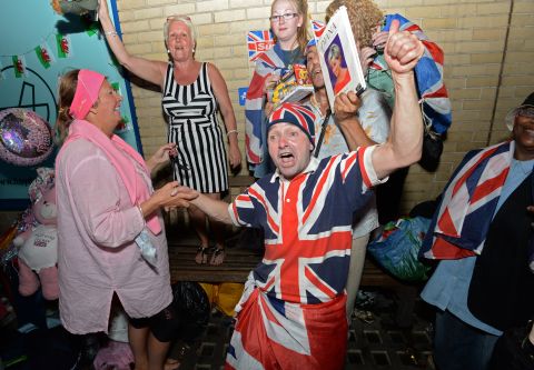 Royal fans celebrate the announcement of the birth of a boy to the Duke and Duchess of Cambridge at St. Mary's Hospital in London on July 22. 