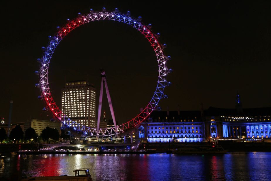 The London Eye Ferris wheel on the banks of the Thames is lit up in red, blue and white to mark the birth of the boy on July 22.