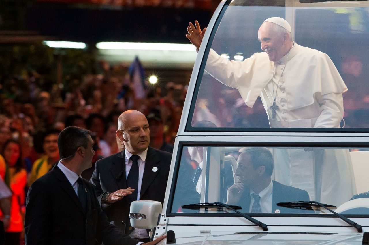 Pope Francis and his security escorts depart the Metropolitan Cathedral in Rio on July 22.