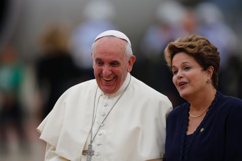 President Dilma Rousseff accompanies Pope Francis after his arrival at the international airport in Rio de Janeiro on July 22.