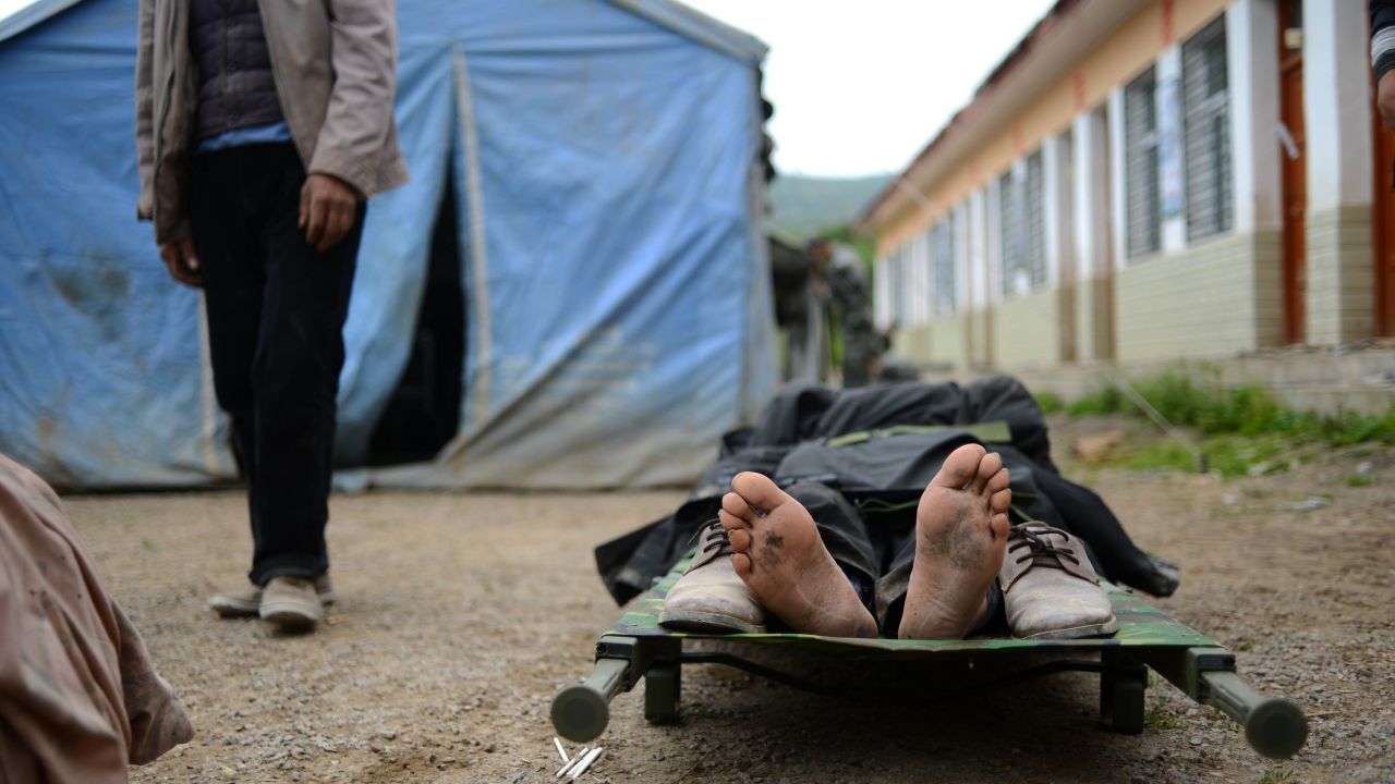 An injured person waits for treatment in Yongxing on July 23.