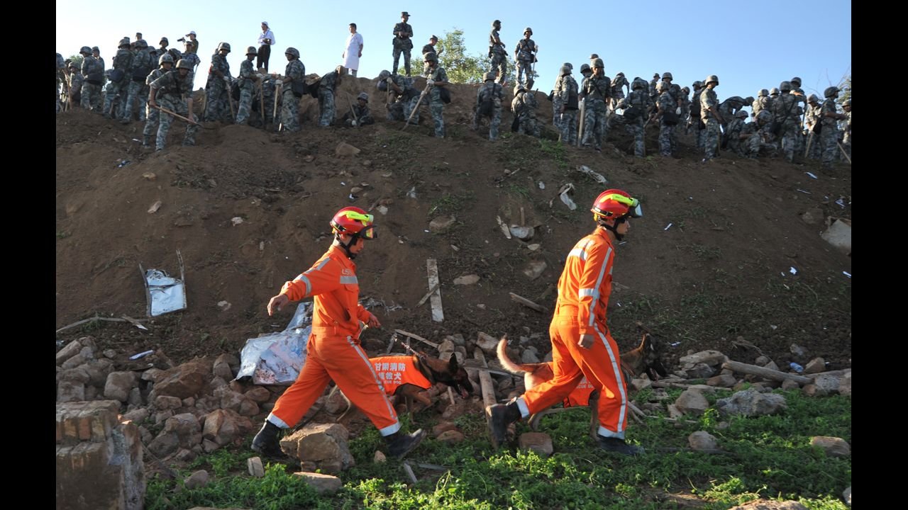Rescuers search for victims in Yongguang on July 23.