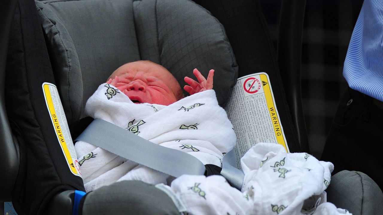 Prince William and Catherine, Duchess of Cambridge's new-born baby boy is introduced to the world's media outside the Lindo Wing of St Mary's Hospital in London on July 23, 2013. The baby was born on Monday afternoon weighing eight pounds six ounces (3.8 kilogrammes). The baby, titled His Royal Highness, Prince (name) of Cambridge, is directly in line to inherit the throne after Charles, Queen Elizabeth II's eldest son and heir, and his eldest son William.   AFP PHOTO / CARL COURT CARL COURT/AFP/Getty Images