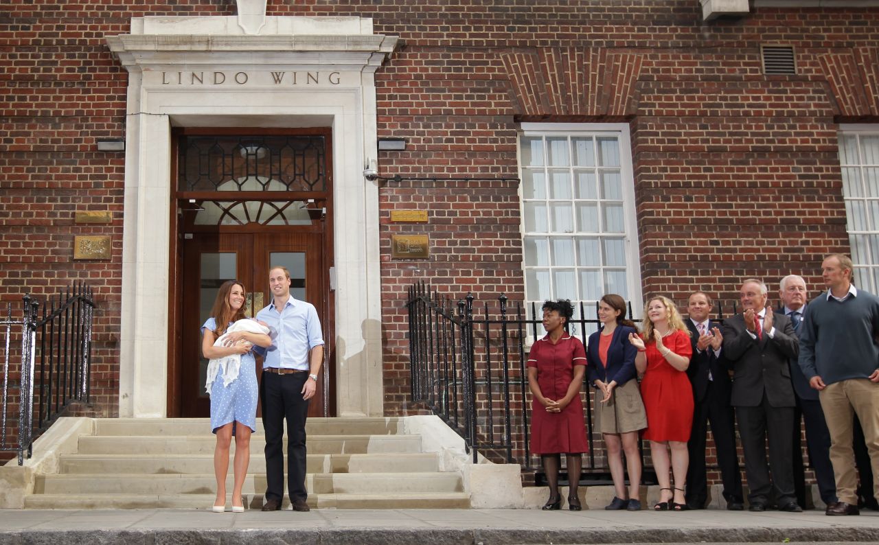 The new parents stand in front of the Lindo Wing of the hospital on July 23, 2013.