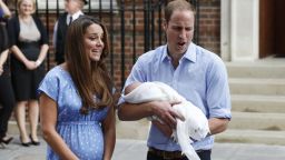 Britain's Prince William and Kate, Duchess of Cambridge hold the Prince of Cambridge, Tuesday July 23, 2013, as they pose for photographers outside St. Mary's Hospital exclusive Lindo Wing in London where the Duchess gave birth on Monday July 22. The Royal couple are expected to head to London's Kensington Palace from the hospital with their newly born son, the third in line to the British throne.  (AP Photo/Lefteris Pitarakis)