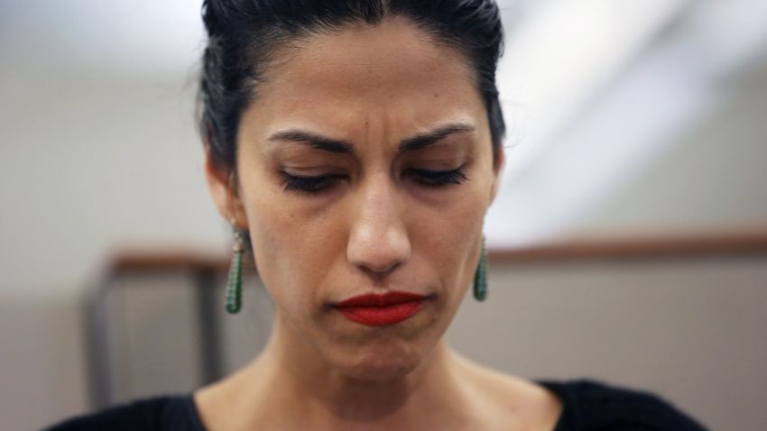 NEW YORK, NY - JULY 23:  Huma Abedin, wife of Anthony Weiner, a leading candidate for New York City mayor, listens as her husband speaks at a press conference on July 23, 2013 in New York City. Weiner addressed news of new allegations that he engaged in lewd online conversations with a woman after he resigned from Congress for similar previous incidents.  (Photo by John Moore/Getty Images)