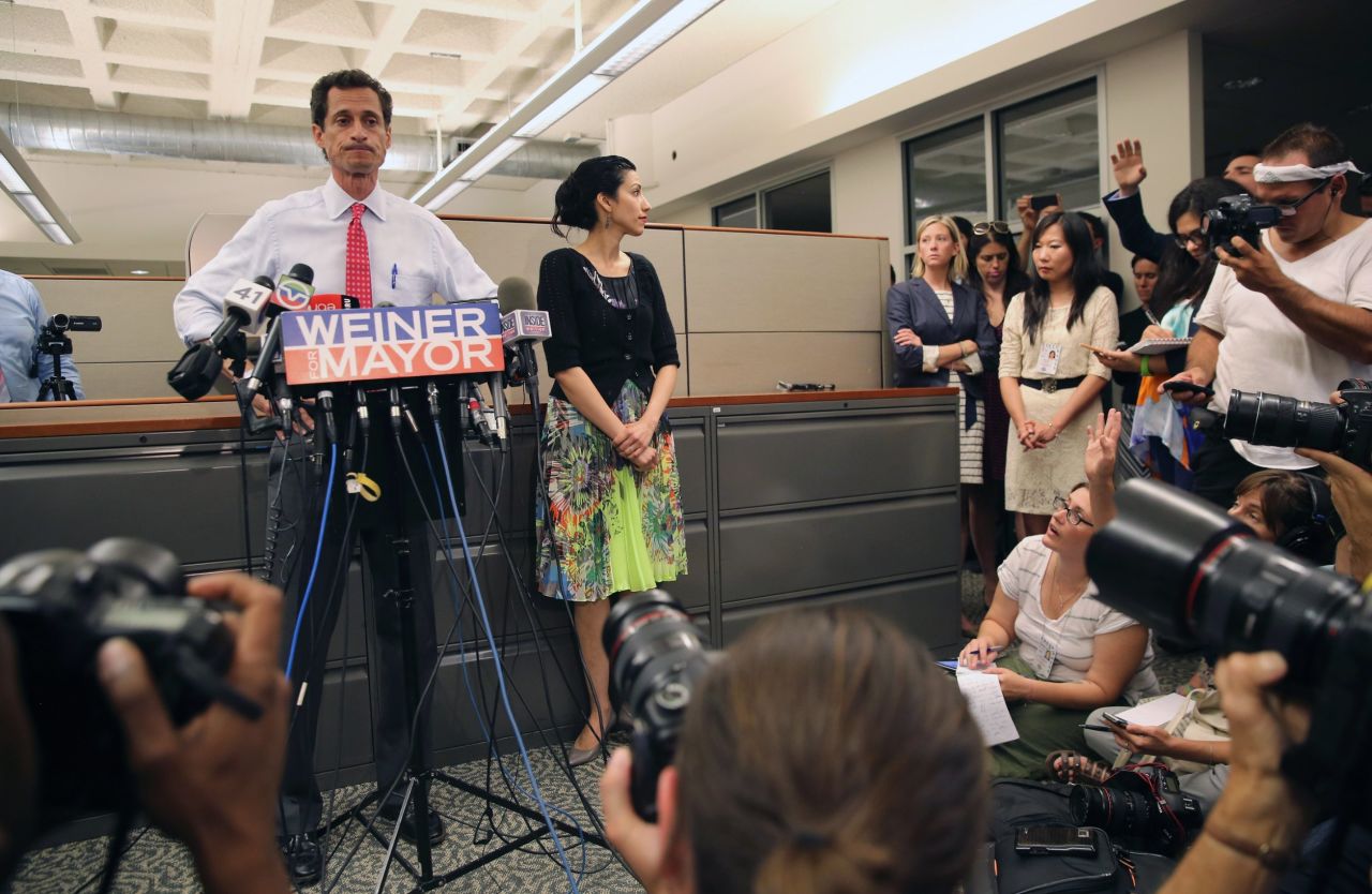 Huma Abedin stood beside her husband, Anthony Weiner, on Tuesday, July 23, as he once again addressed issues surrounding sending explicit messages over the Internet. At times she smiled, other times she appeared solemn, but her message was clear: She is standing by her husband. Abedin has worked for former Secretary of State Hillary Clinton for more than a decade, and while she's known for shying away from the spotlight, she can often be seen just offstage.