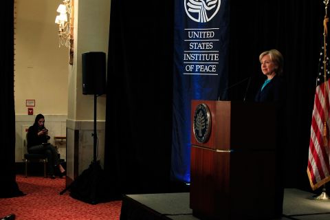 Abedin sits offstage as Clinton speaks on reinvigorating the United States' nonproliferation policy on October 21, 2009, at the Mayflower Hotel in Washington.
