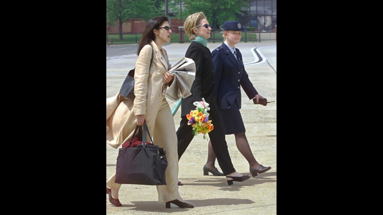 Serving as Clinton's personal aide, Abedin accompanies Clinton on a trip from New York  to Andrews Air Force Base in Maryland on May 6, 2000, to meet with President Bill Clinton.