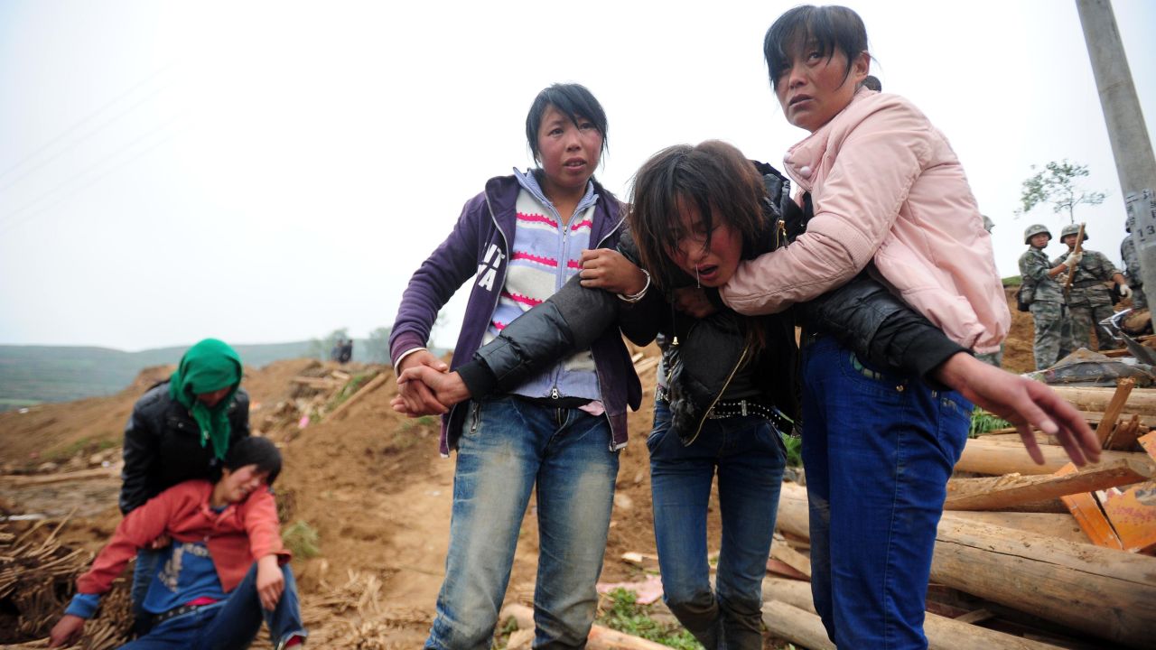 Villagers grieve in Yongguang, China, on July 23.
