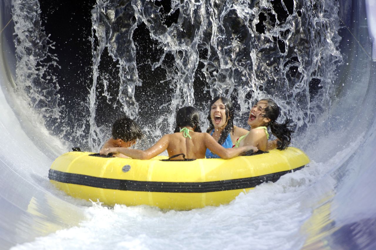 Riding Wahoo Run at Adventure Island in Tampa, Florida, provides soaking wet thrills. Rafts carrying as many as five people shoot through a water flume at speeds exceeding 20 feet per second. They corkscrew through a half-enclosed tunnel into a splash pool. More than 650,000 people passed through Adventure Island's gates last year, according to the Themed Entertainment Association.