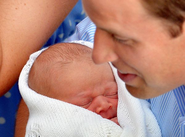 JULY 24 - LONDON, UK: Prince William, the Duke of Cambridge, holds his <a href="http://cnn.com/2013/07/23/world/europe/uk-royal-baby/index.html?hpt=hp_c1">new-born son in front of the world's media</a> outside St Mary's Hospital on July 23. The baby was born on Monday afternoon weighing 8 pounds, 6 ounces. The yet to be named child, who is the <a href="http://cnn.com/2011/10/28/world/europe/royal-succession-qa">third in line</a> to the British throne, will carry the title of His Royal Highness, Prince (name) of Cambridge.