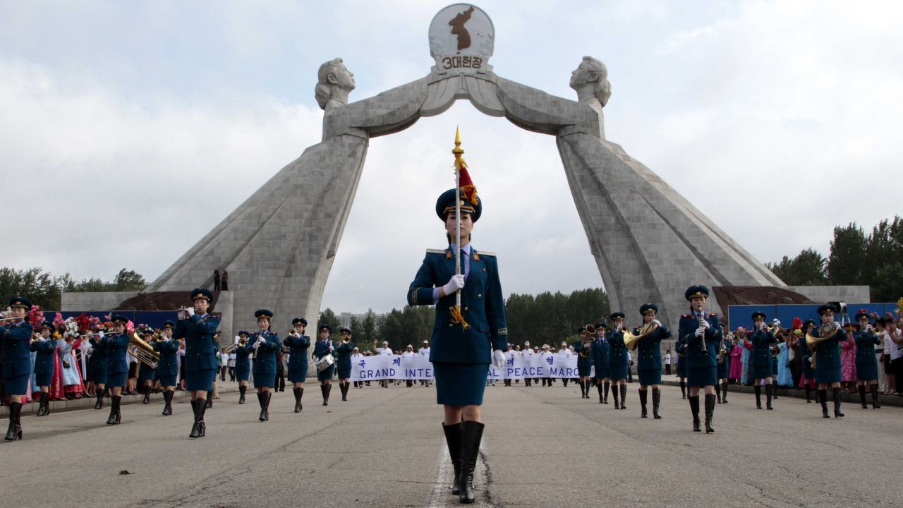 The North Korean military band leads an international peace march at the Three Charters for National Reunification Memorial Tower in Pyongyang on July 24. This was the first war in which the United Nations played a role and the first to battle with jet aircraft.