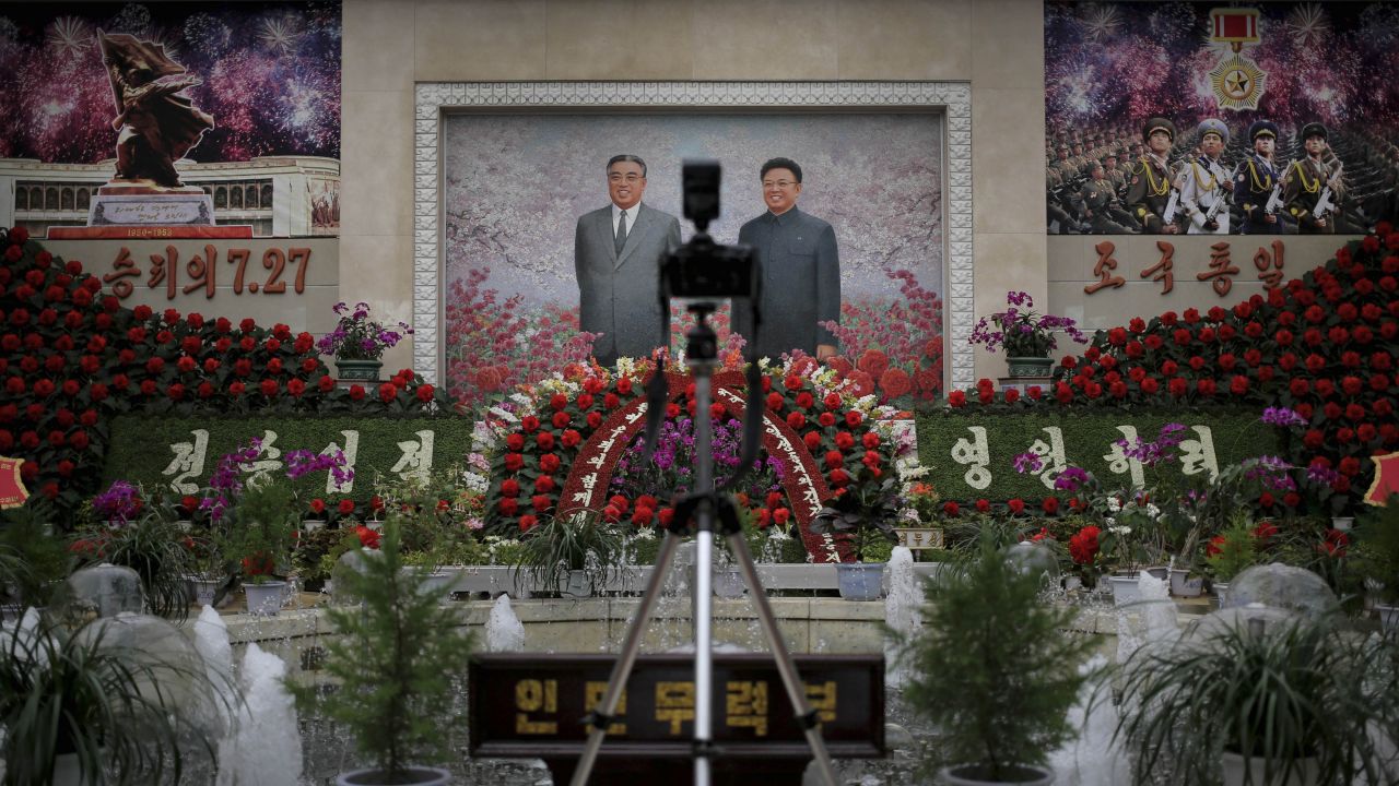 A mosaic of the late leaders Kim Il Sung and Kim Jong Il is on display at an exhibition in Pyongyang on July 24.