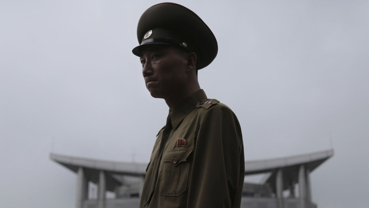 A North Korean soldier explains the history of the armistice agreement between North and South Korea at the truce village of Panmunjom in the demilitarized zone on Monday, July 22. The demilitarized zone separates the two Koreas and remains one of the most tense borders in the world.